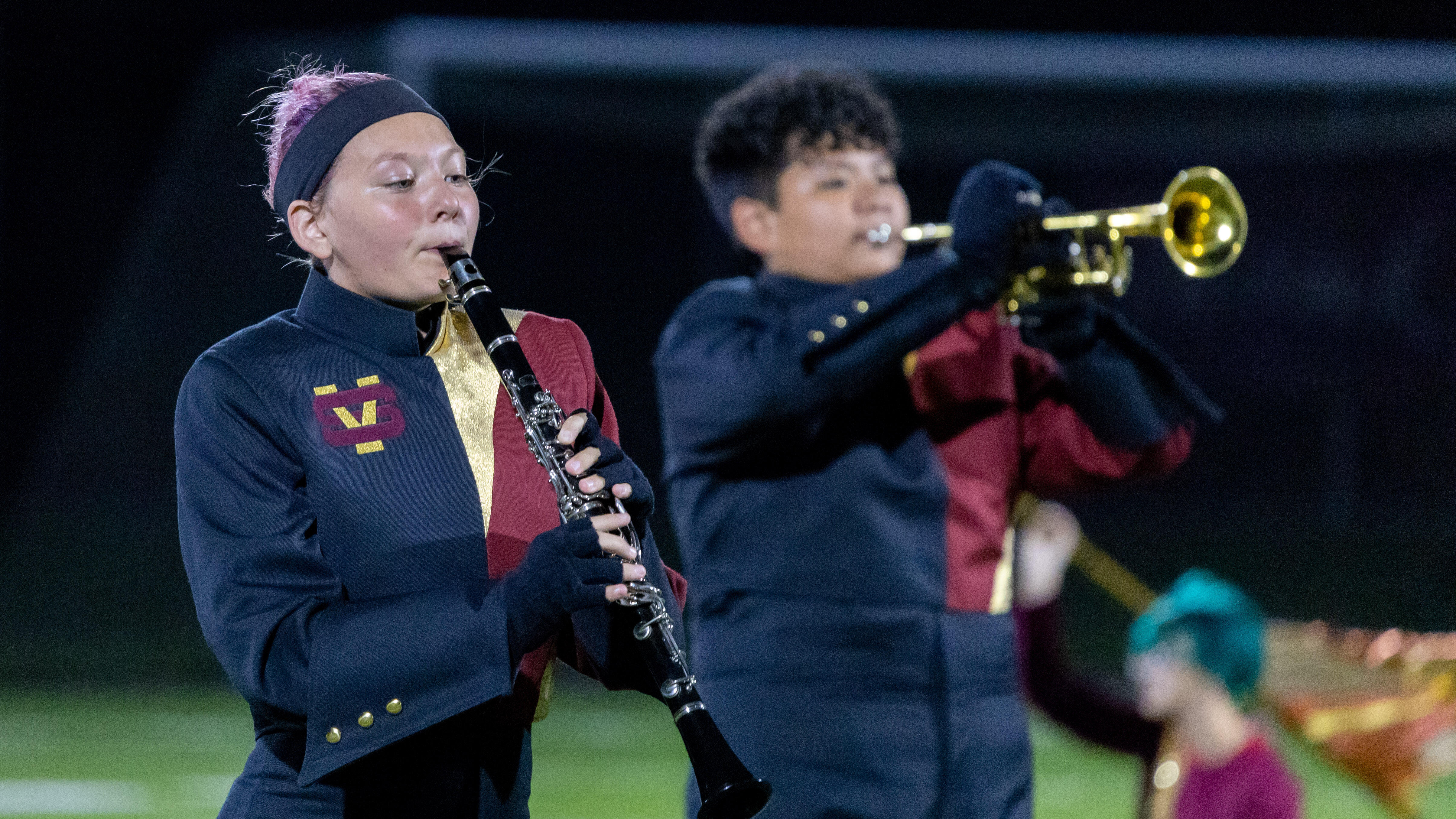 The Steel Valley Marching Band performs during halftime of a football game. Clarinet player Loki Brown is in the foreground.
