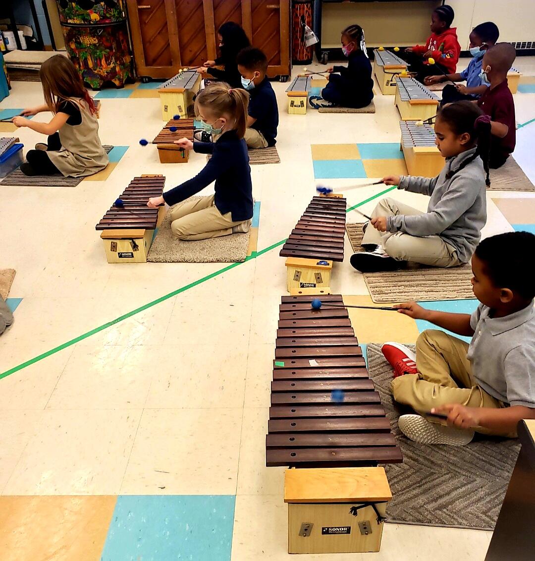 Barrett Elementary students play xylophones during music class