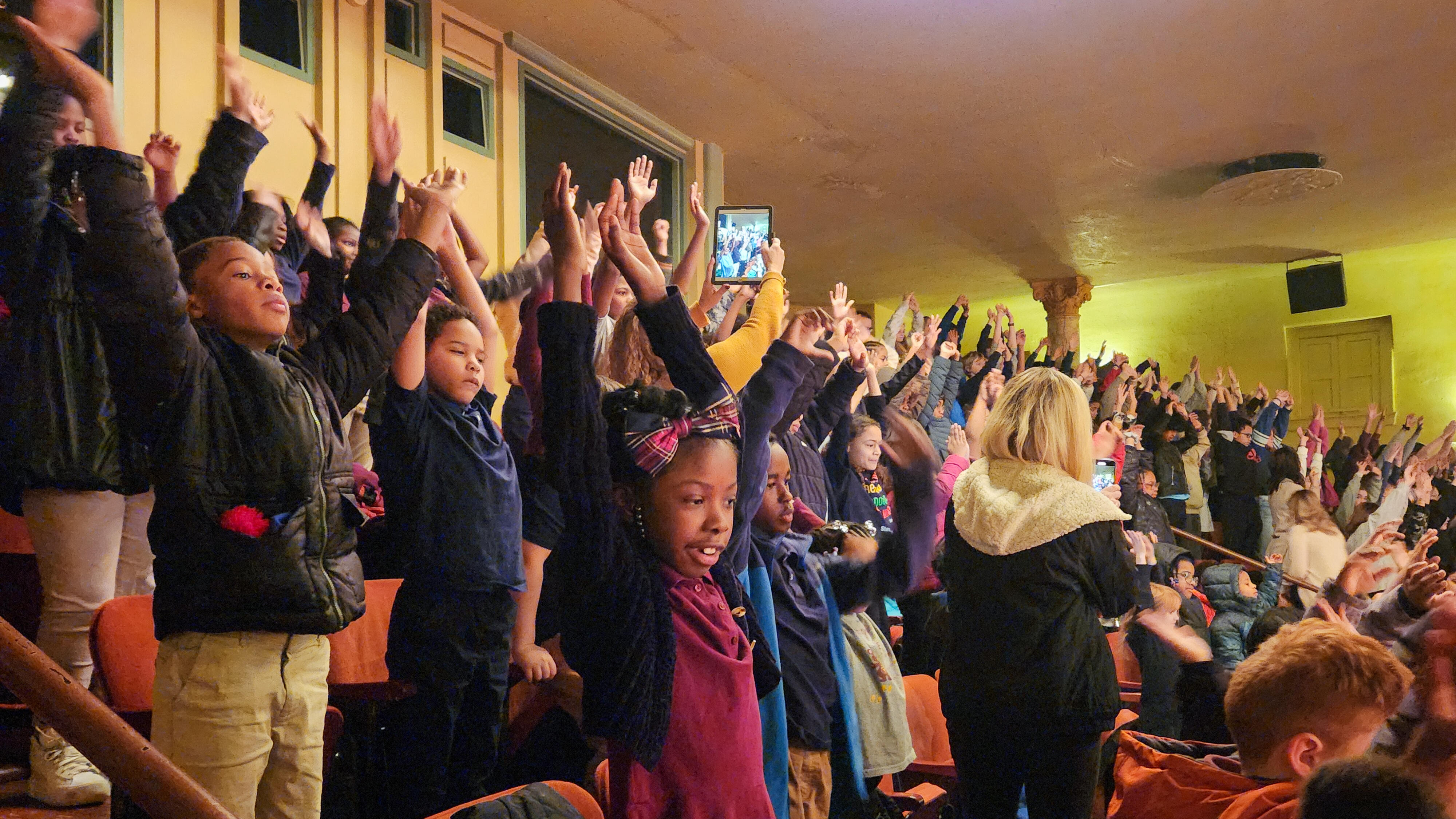 Barrett Elementary students participate in an interactive portion of Step Afrika performance at the Byham Theater