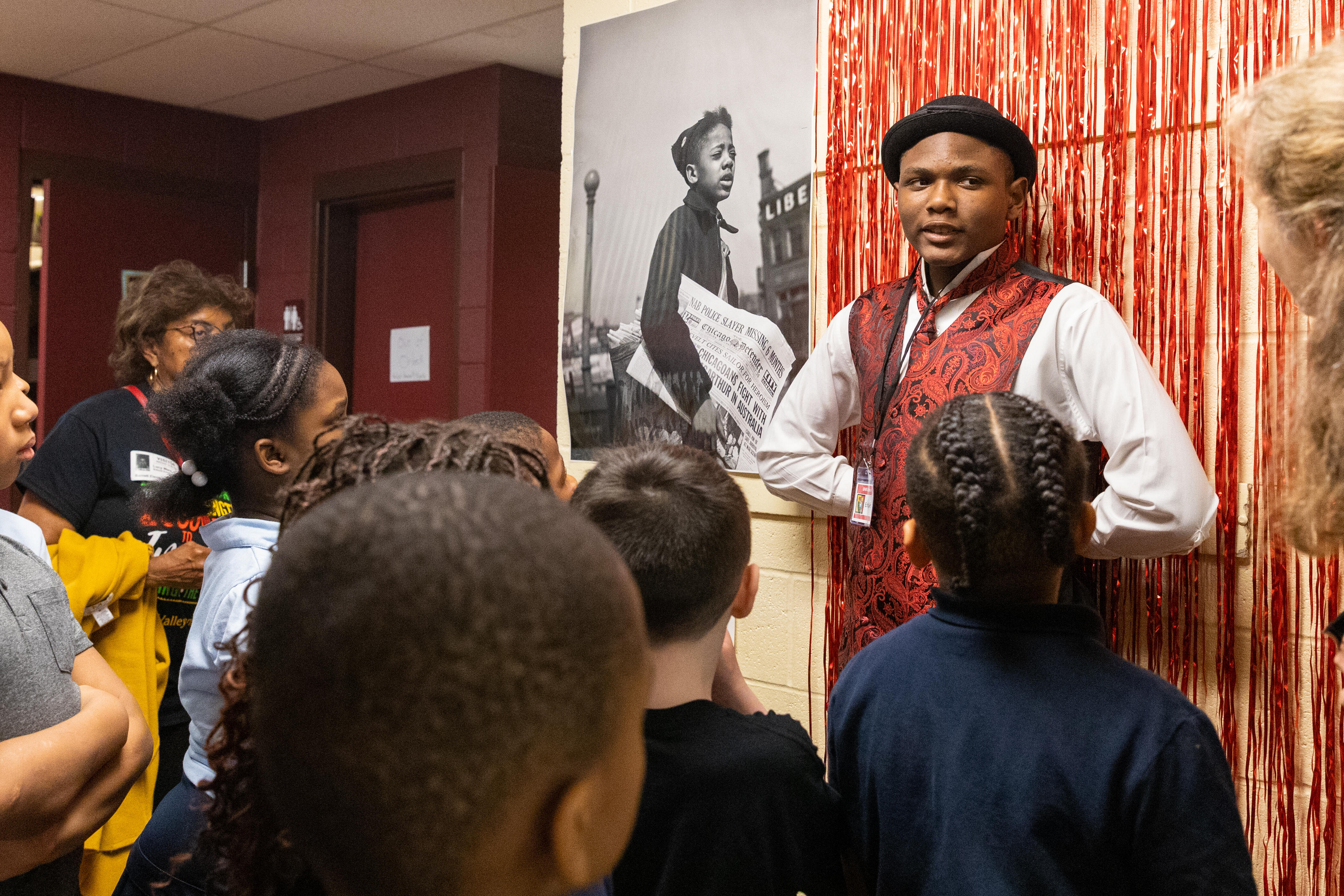 A Steel Valley student portrays a wax figure for younger students at the Black History Month Interactive Living Museum.
