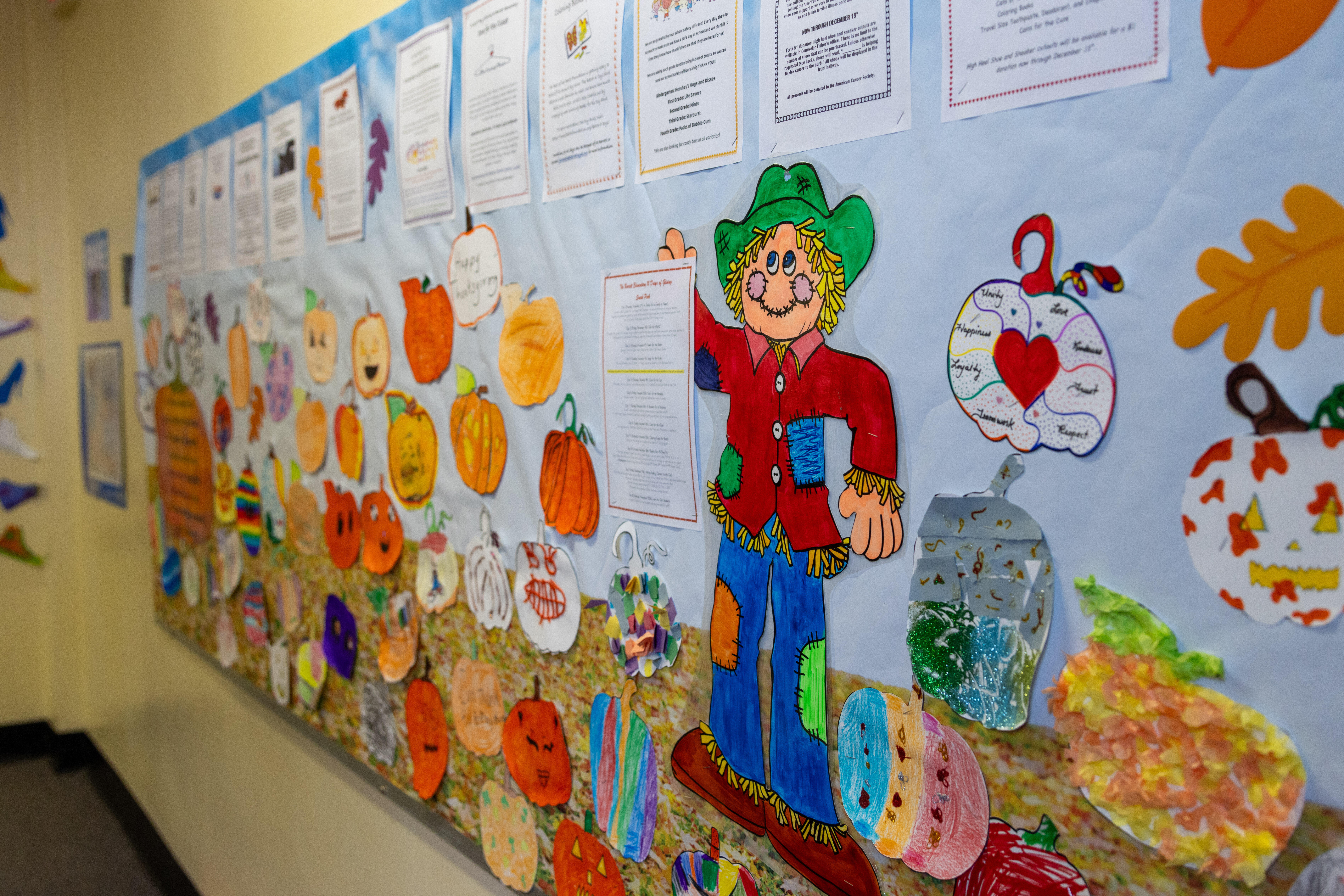 A poster of a pumpkin patch with children's art