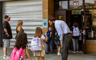 Park Elementary principal Dr. Thomas Shaughnessy greets new students on the first day of school.