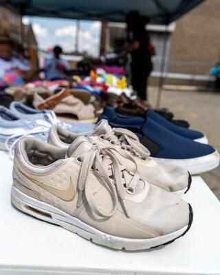 Pairs of shoes sit on a table at the Salvation Army Steel Valley Corps' Back to School Backpack Bash