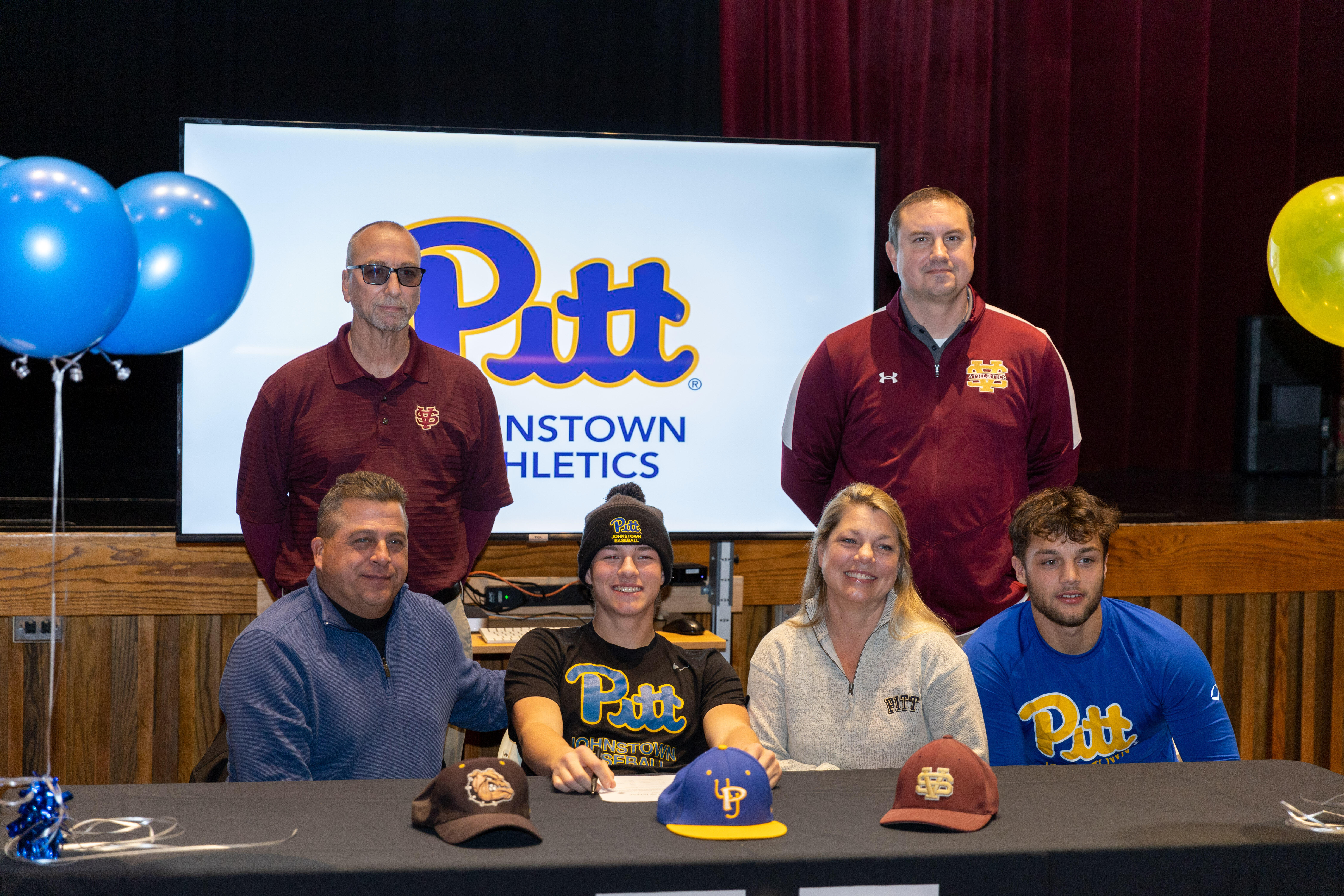 Steel Valley senior Roman Donis signs his National Letter of Intent to play collegiate baseball at Pitt-Johnston. Joining him at the ceremony were his parents, Mark and Marnyn Donis, brother Noah Donis, Steel Valley varsity baseball head coach Kevin Walsh (standing) and Steel Valley varsity assistant baseball coach Matthew Simpson (standing).
