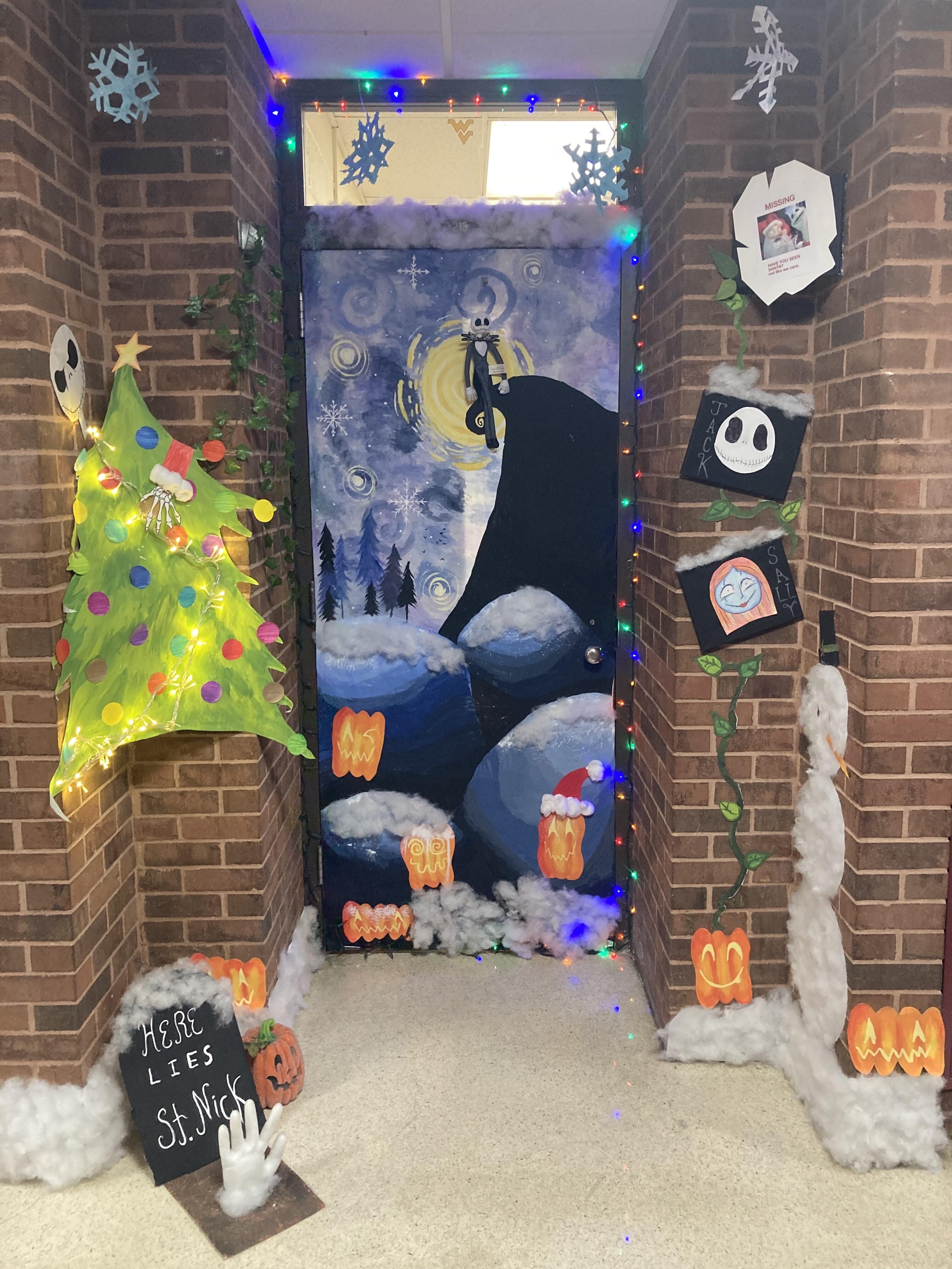 A classroom door is decorated to celebrate the holidays. The decorations have a Nightmare Before Christmas theme to them.
