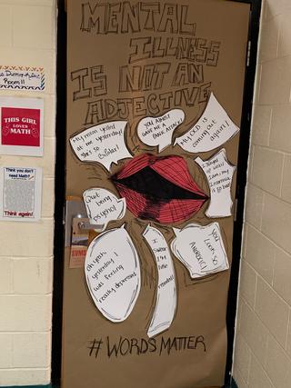 Door decorated: "Mental Health is not an adjective"