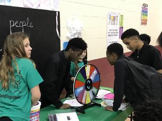 Students participating in spinning wheel game